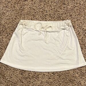 BCBG size medium white skirt with detailed band and bow